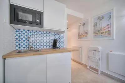 a kitchen with a sink and a microwave at Jul - Studette - Croisette - VCA in Cannes