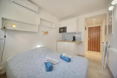 a bedroom with a bed with towels on it at Jul - Studette - Croisette - VCA in Cannes