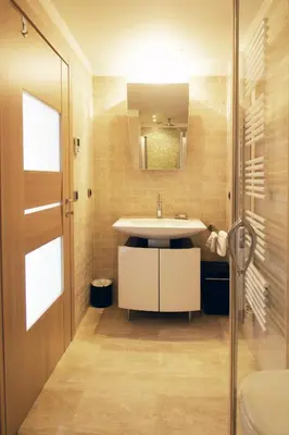 a bathroom with a sink and a mirror at T3 vue mer LE MACE PLAGE in Cannes
