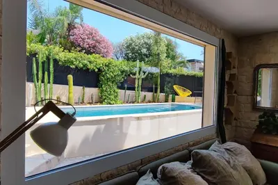 a window in a room with a view of a swimming pool at FRGK