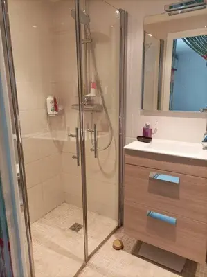 a bathroom with a shower and a sink at FRGK
