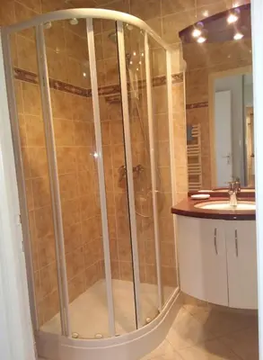 a bathroom with a shower and a sink at Cozy cocoon with balcony close to the sea in Cannes