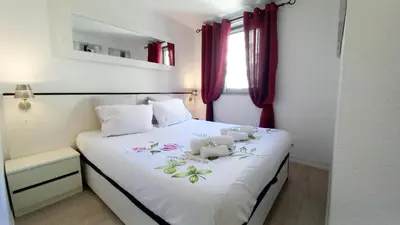 a bedroom with two teddy bears on a bed at Les Félibriges in Cannes