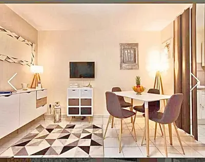 a kitchen and dining room with a table and chairs at Appartement Canne 1 chambre - 52C in Cannes