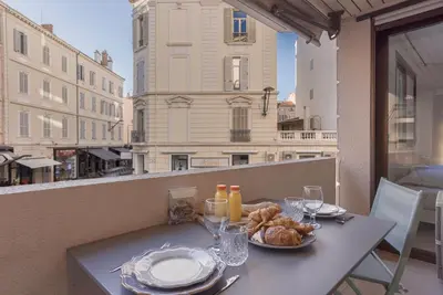 a table with a plate of food on a balcony at 