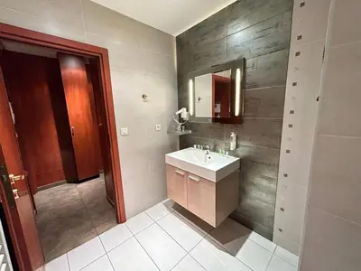 a bathroom with a sink and a mirror at Carnot in Cannes