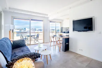 a living room with a couch and a tv at One BDRM flat A/C-Congress/Beaches by Olidesi in Cannes