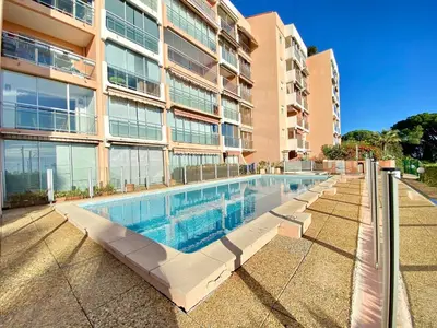 a large swimming pool in front of a building at Cannes Les Plages By SCLS Locations in Cannes