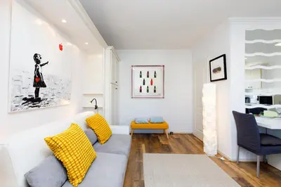 a living room with a couch and a table at Dolce Vita YourHostHelper in Cannes