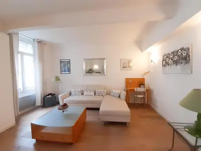 a living room with a couch and a table at Gloria in Cannes