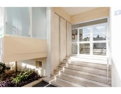 a building with stairs in front of a window at Bright 2 Bed Apt in Cannes, 10 min to Palais in Cannes