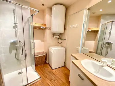 a bathroom with a shower and a sink and a toilet at La Rotonde By SCLS Locations in Cannes