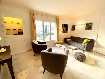 a living room with a couch and chairs at La Rotonde By SCLS Locations in Cannes