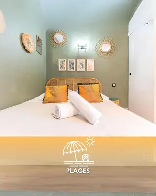 a bed with two pillows and an umbrella on it at 