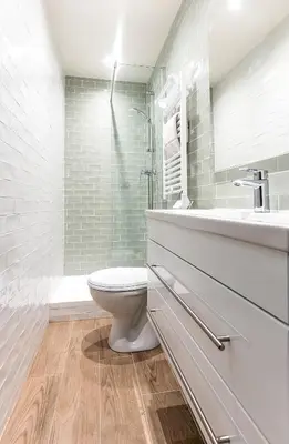 a white bathroom with a toilet and a sink at 