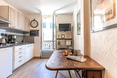a kitchen with a wooden table in a room at 