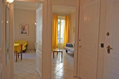 a hallway with a living room and a dining room at Mimosa 1 in Cannes