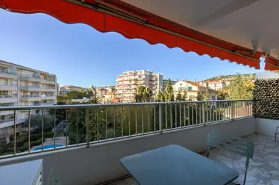a balcony with a view of a city at Appartement, 2 pièces, à deux pas de la Croisette in Cannes