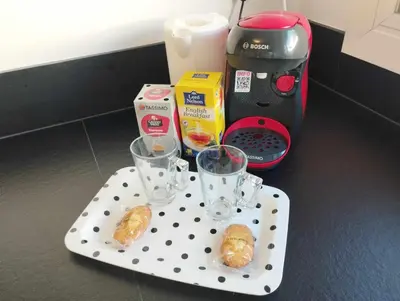 a polka dot tray with two glasses and a coffee maker at Cannes Pointe Croisette T2 plage 2min à pieds 46m2 in Cannes