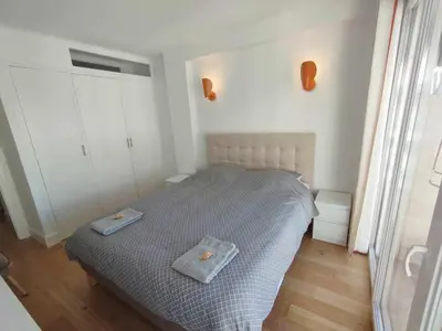 a bedroom with a bed with two towels on it at Cannes Pointe Croisette T2 plage 2min à pieds 46m2 in Cannes