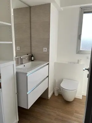 a white bathroom with a sink and a toilet at Eden Residence in Cannes