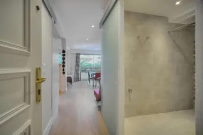 a hallway with a walk in shower in a home at Confortable Studio BALCON, Rouaze- CARLON MARTINEZ A0B123 in Cannes