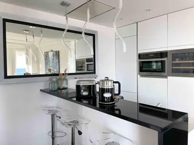 a kitchen with a counter with a coffee maker on it at Stunning 2 bedroom flat with sea view on Croisette in Cannes