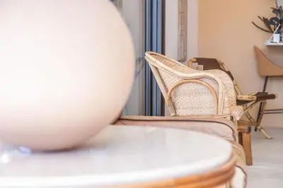 a table with a white bowl on top of a table at LB Vacation Rentals I A short Stroll to Palais, Beach, Terrace & Seaview in Cannes
