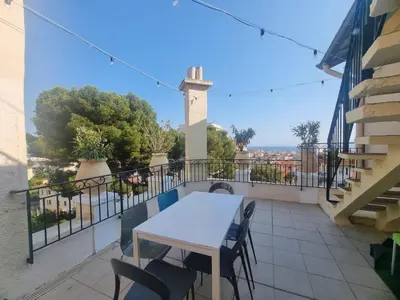 a table and chairs on a balcony with a view at Appartement Grasse Toit Terrasse in Cannes