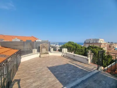 a balcony with a view of a city at Appartement Grasse Toit Terrasse in Cannes