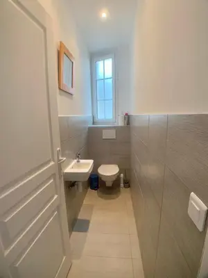 a bathroom with a toilet and a sink at Appartement Grasse Toit Terrasse in Cannes