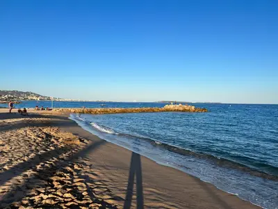 a beach with a body of water with people on it at Fiorella's Cannes Oasis in Cannes