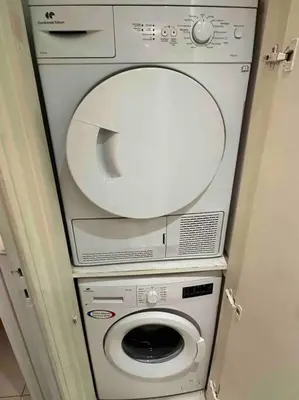 a washing machine with a mirror on top of it at Superbe Appartement Cannes - 50m2 & Terrasse - Très Proche Croisette in Cannes
