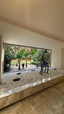 a statue of a giraffe in a room with a window at Superbe Appartement Cannes - 50m2 & Terrasse - Très Proche Croisette in Cannes