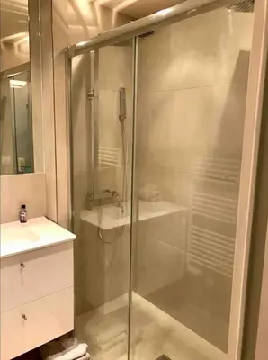 a shower with a glass door in a bathroom at Superbe Appartement Cannes - 50m2 & Terrasse - Très Proche Croisette in Cannes