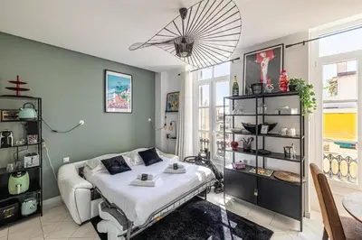 a bedroom with a bed and a table in it at PRIVATE - Small studio for two at 5 minutes from Croisette in Cannes