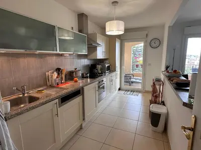 a kitchen with a sink and a counter at 2 bedroom apartment with a pool in the heart of Cannes easy walk to the main beach on La Croisette - 2191 in Cannes