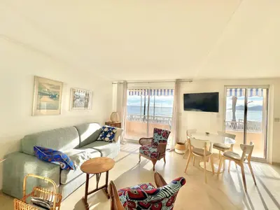 a living room with a couch and a table and chairs at Shelly luxury sea view by Welcome to Cannes in Cannes