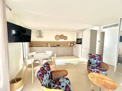 a kitchen and living room with a table and chairs at Shelly luxury sea view by Welcome to Cannes in Cannes