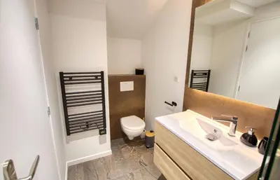 a bathroom with a sink and a toilet at Maison Moderne Cannes 3 Chambres 3 Salles de Bain WIFI - LIMESTAY in Cannes