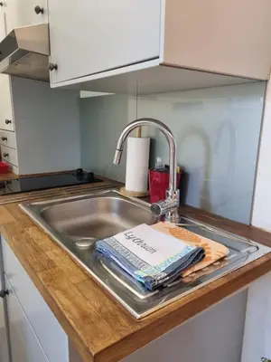 a kitchen counter with a sink with a towel at Cannes Studio privé climatisé et bon wifi in Cannes