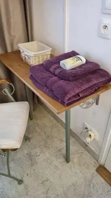 a table with a purple towel on top of it at Cannes Studio privé climatisé et bon wifi in Cannes