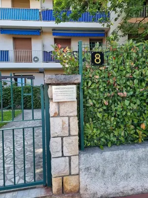 a fence with a gate with the number eight on it at Cannes Studio privé climatisé et bon wifi in Cannes