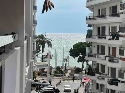 a view of a street from a building with the ocean at Plage luxe collé à l’hôtel Martinez in Cannes