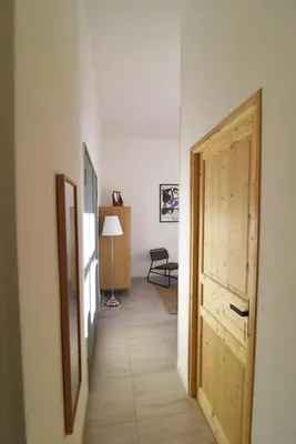 a hallway with a door leading to a room at Charming studio very central and calm in Cannes