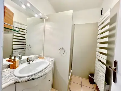 a bathroom with a sink and a shower at Savannah appartement proche Carlton, by Welcome to Cannes in Cannes