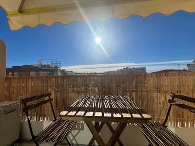 a table and two chairs sitting on a balcony at Savannah appartement proche Carlton, by Welcome to Cannes in Cannes