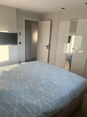 a bedroom with a large bed in a room at Appartement MARTINEZ 5 couchages in Cannes