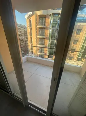 a view of a balcony from a window in a building at Appartement MARTINEZ 5 couchages in Cannes