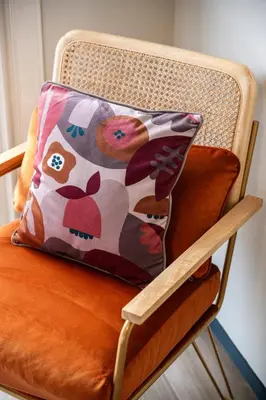 a pillow sitting on top of a chair at Jessicannes - COOPER - 3 chambres - Central, spacieux, terrasse in Cannes